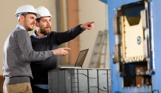 Two Men Working on Manufacturing IT