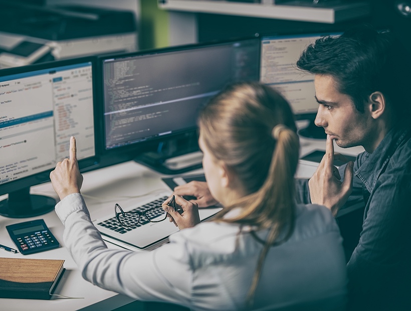 two people on a computer