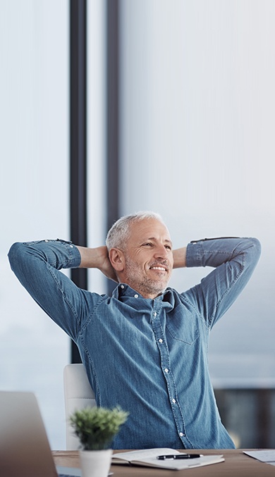 Man leaning back in chair