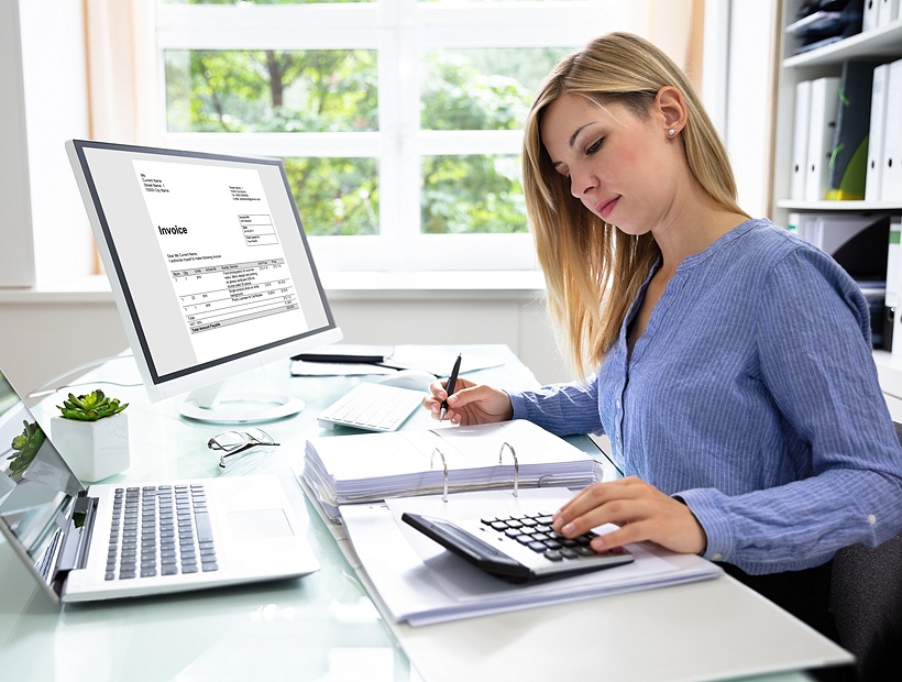 woman at computer calculating