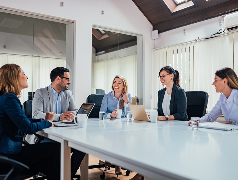 group of people sitting in meeting room