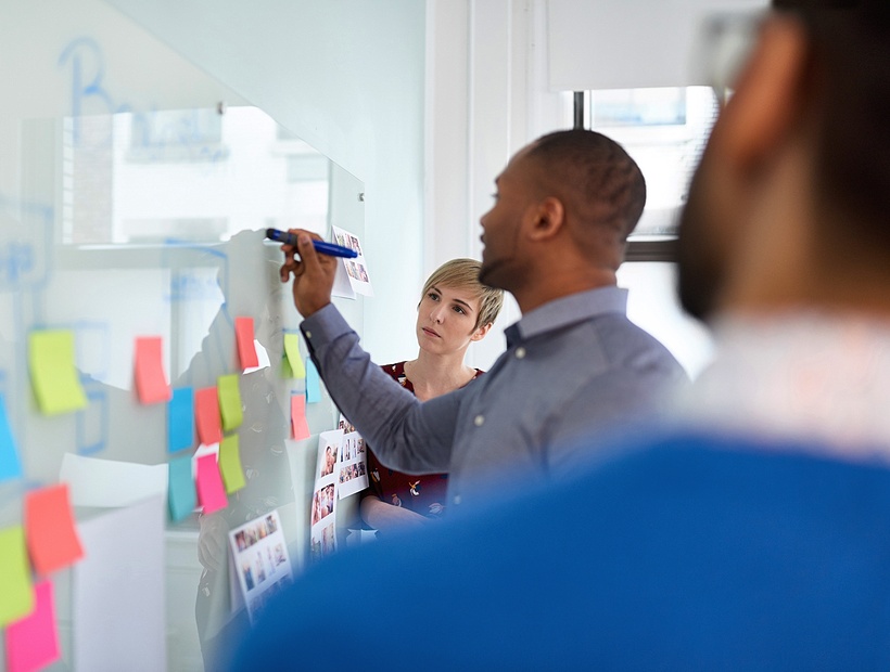 team working on whiteboard